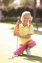 Young Girl Practising Golf Royalty Free Stock Photo