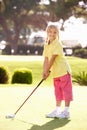 Young Girl Practising Golf Royalty Free Stock Photo