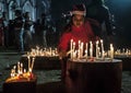 The young girl is praying for Christmas eve with candle lights. Royalty Free Stock Photo