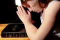 Young Girl Praying Over Bible Royalty Free Stock Photo