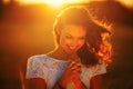 A young girl prays at sunset Royalty Free Stock Photo