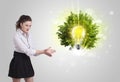 Young girl presenting idea light bulb Royalty Free Stock Photo