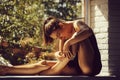 Pretty girl on window sill Royalty Free Stock Photo