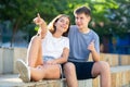 Girl prompts the boy, pointing with his hand at something Royalty Free Stock Photo