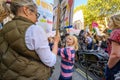 Young girl protesting at an Extinction Rebellion march on Whitehall, London with The Cenotaph in the background