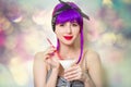 Girl with purple hair holding cocktail Royalty Free Stock Photo