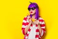 Girl with purple hair holding lemonade cocktail Royalty Free Stock Photo