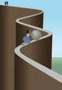 A young girl pushes a large metallic ball up a narrow steep and dangerous path