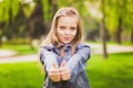 Young girl puts her big thumbs up Royalty Free Stock Photo