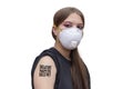 Young girl with a QR code on her shoulder in a medical mask on a white background, isolate. Concept: vaccination and chipping, obs