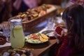 A young girl raises her hands in prayer as she prepares for her iftar meal during the holy month of Ramadan, embodying Royalty Free Stock Photo