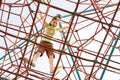 Young girl reached the top of the giant climbing