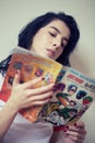 Girl reading comics Royalty Free Stock Photo