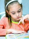 Young girl reading book