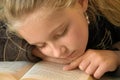 Young girl reading book