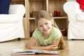 Young Girl Reading Book at Home Royalty Free Stock Photo