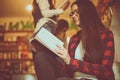 Young girl reading book in library. Royalty Free Stock Photo