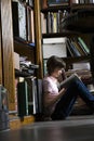 Young Girl Reading Book In Library Royalty Free Stock Photo