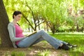 Young girl reading book in nature Royalty Free Stock Photo