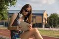 The Perfect Harmony: Young Girl Embracing Education and Music in the Park