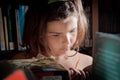 Young girl reading in a library