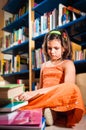 Young girl reading in a library