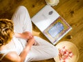 Young girl reading the bhagavad gita in the light of the setting suns