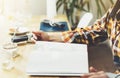 Young girl reads book during breakfast and coffee, female hands close up flipping through magazine pages in home relax atmosphere