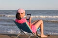 Young girl reads her ebook Royalty Free Stock Photo