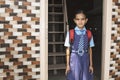 A young girl ready with uniform - small kid leaving home for school - Concept of back to school and starting Royalty Free Stock Photo