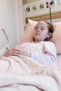 Young tween girl in hospital bed Royalty Free Stock Photo