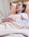 Young tween girl in hospital bed Royalty Free Stock Photo