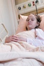 Young tween girl in hospital bed Royalty Free Stock Photo