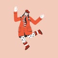 Young girl in red coat jumping and spreading her arms Royalty Free Stock Photo