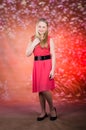 Young girl in red dress pose in studio Royalty Free Stock Photo