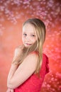 Young girl in red dress pose in studio Royalty Free Stock Photo