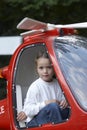 Young girl in the red helicopter 01 Royalty Free Stock Photo