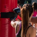 Young Girl and Red Punching Bags and Mitts, Boxing & Fitness