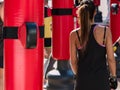 Young Girl and Red Punching Bags and Mitts, Boxing & Fitness