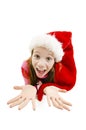 Young girl in red Santa hat. Looking up expects gifts from Santa for Christmas Royalty Free Stock Photo