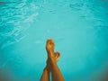 Young Girl Relaxing Her Feet At Swimming Pool Royalty Free Stock Photo