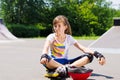 Young girl relaxing with her skating gear Royalty Free Stock Photo