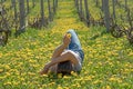 Young girl is relaxing lying on the grass in the vineyard Royalty Free Stock Photo