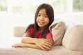 Young Girl Relaxing On Sofa At Home Royalty Free Stock Photo