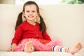 Young Girl Relaxing On Sofa At Home Royalty Free Stock Photo