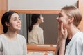 A young girl repeats for therapist exercises for the proper motility of the jaw