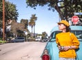 Young girl in a retro car in California Royalty Free Stock Photo