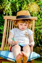 Pretty young girl revising or learning her lessons in the garden Royalty Free Stock Photo