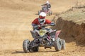 Young girl rider on a quad bike in the race