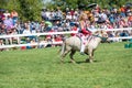Young girl rides a pony in front of onlookers at the RCMP Musical Ride